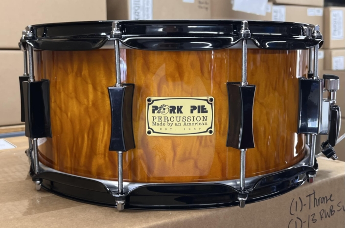 Amber Gloss Curly Maple with Black Hardware